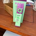 A green and purple package of PurQ Gut Care Queen Garnet Powder with Pre + Probiotic supplement sitting on a wooden table