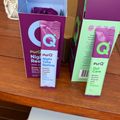 PurQ supplement products displayed on wooden surface including Night Time Restore and Gut Care varieties in colorful packaging