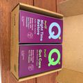 Two purple boxes of Purdy brand supplements - Night Time Restore and Gut Care - sitting in a cardboard shipping box on a wooden surface