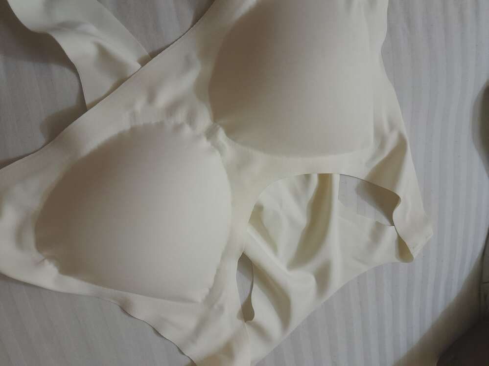 White fabric ribbons arranged in flowing, curved patterns
