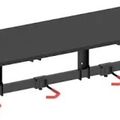 A long rectangular table with an adjustable height mechanism and red curved hooks or attachments underneath the support rail