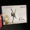 Package box for a Mount-It low-profile swivel TV wall mount showing product illustration and specifications