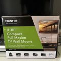 Mount-It brand TV wall mount product box for 17-50 inch TVs, featuring compact full motion design with green and white packaging