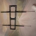 A hand-drawn sketch of a SIM card tray with two horizontal lines extending from either side, drawn on white paper