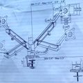 Technical diagram showing a multi-monitor desk mount arm with articulating joints, rotation angles, and dimensional measurements for mounting multiple computer screens