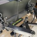 Flight simulator cockpit setup with control yoke, throttle quadrant, and instrument panel on wooden desk