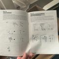 Assembly instruction manual pages showing steps 5a and 5b for mounting hardware to a solid wood wall or desk, with detailed diagrams and illustrations