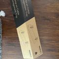 Cable management tray product box lying on wooden floor