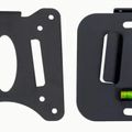 Two black mounting brackets with holes and slots, one flat plate-style and one with a bubble level indicator