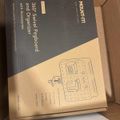 Box containing a 360-degree swivel pegboard and organizer with accessories, showing product packaging with diagram and text