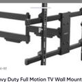 Heavy duty full motion TV wall mount with articulating arms and black metal construction