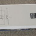 Technical diagram and mounting bracket for TV wall mount installation shown on packaging
