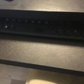 Black laptop keyboard on a textured surface