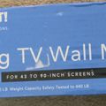 Package for Mount-It tilting TV wall mount for 43 to 90-inch screens with blue packaging and white text
