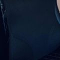Person wearing a dark colored sleeveless top or dress