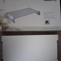 Product packaging for a MOUNT-IT! slim aluminum monitor riser stand in silver, showing product specifications and an illustration of the curved desktop stand