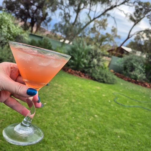 Customer photo from Sharon S.'s review: a cocktail in a glass in the garden
