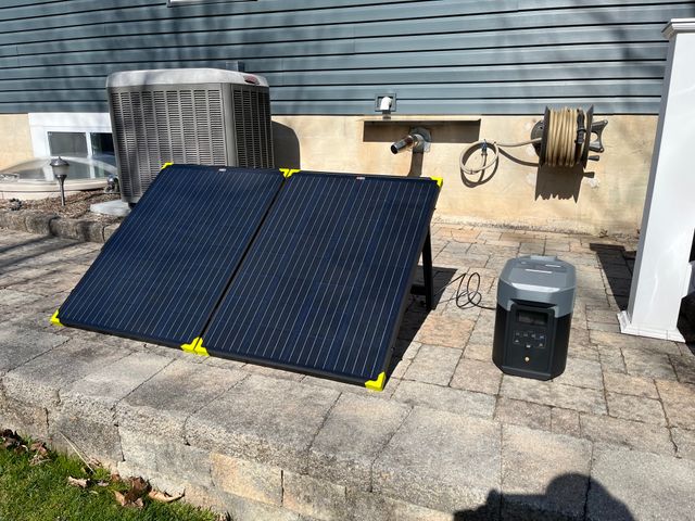Keith S.'s folding solar panel charging an EcoFlow DELTA 2 Max on a patio
