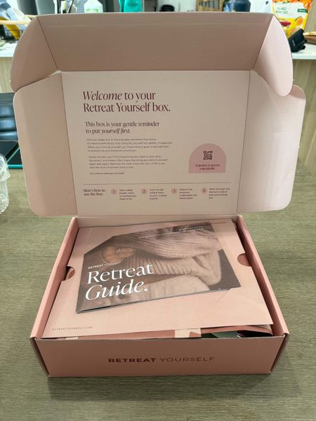 Customer photo: an open Retreat Box showing the welcome card and Retreat Guide