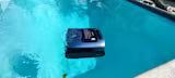 Robotic pool cleaner in bright blue swimming pool water