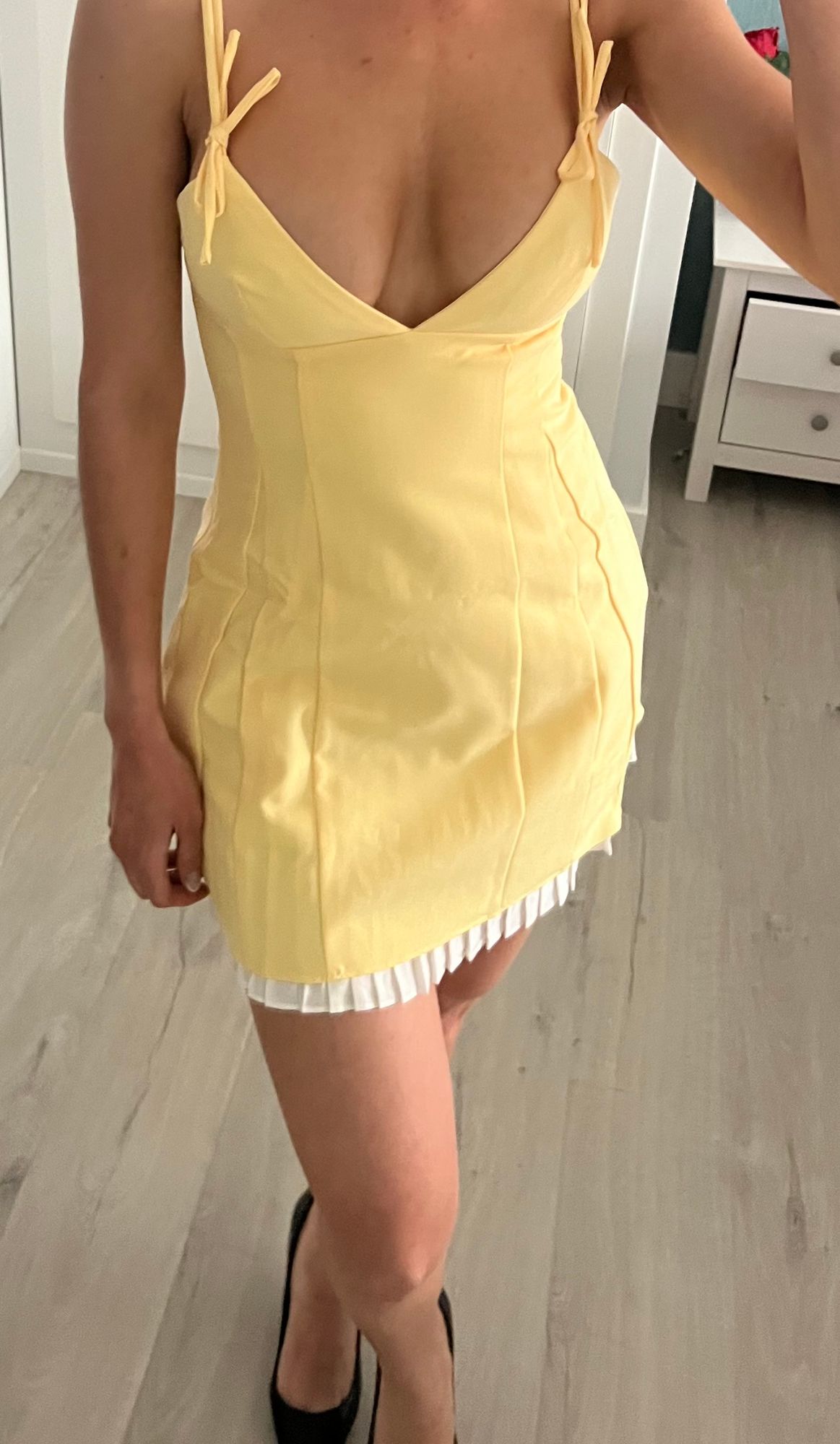Bronwyn Bow-Detail Pleated Mini Dress in Pastel Yellow | Oh Polly