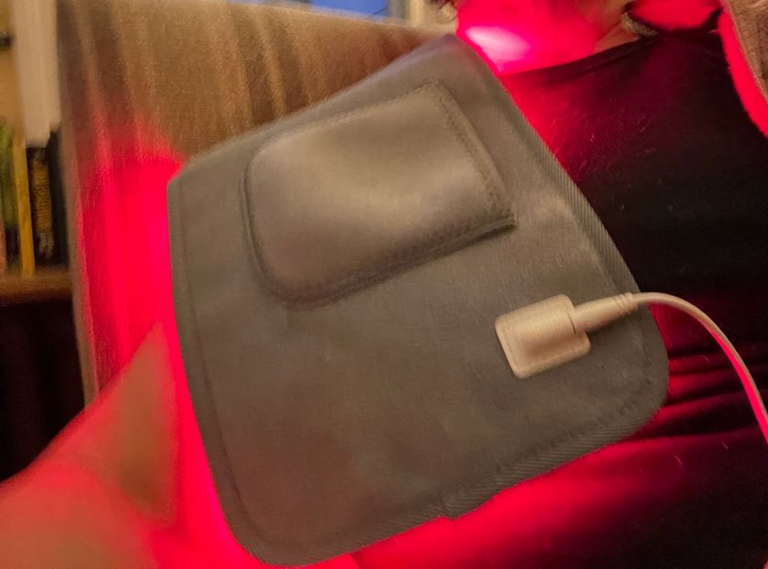 Customer photo from Sherri O.: using the Novaa Light Pad on the couch after an evening run