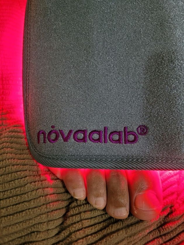 Customer photo from Roberta p.: the Novaa Light Pad with its embroidered logo in use at home
