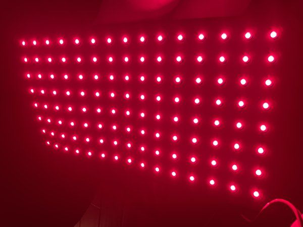 Close-up of the Novaa Light Pad's red LED array illuminated