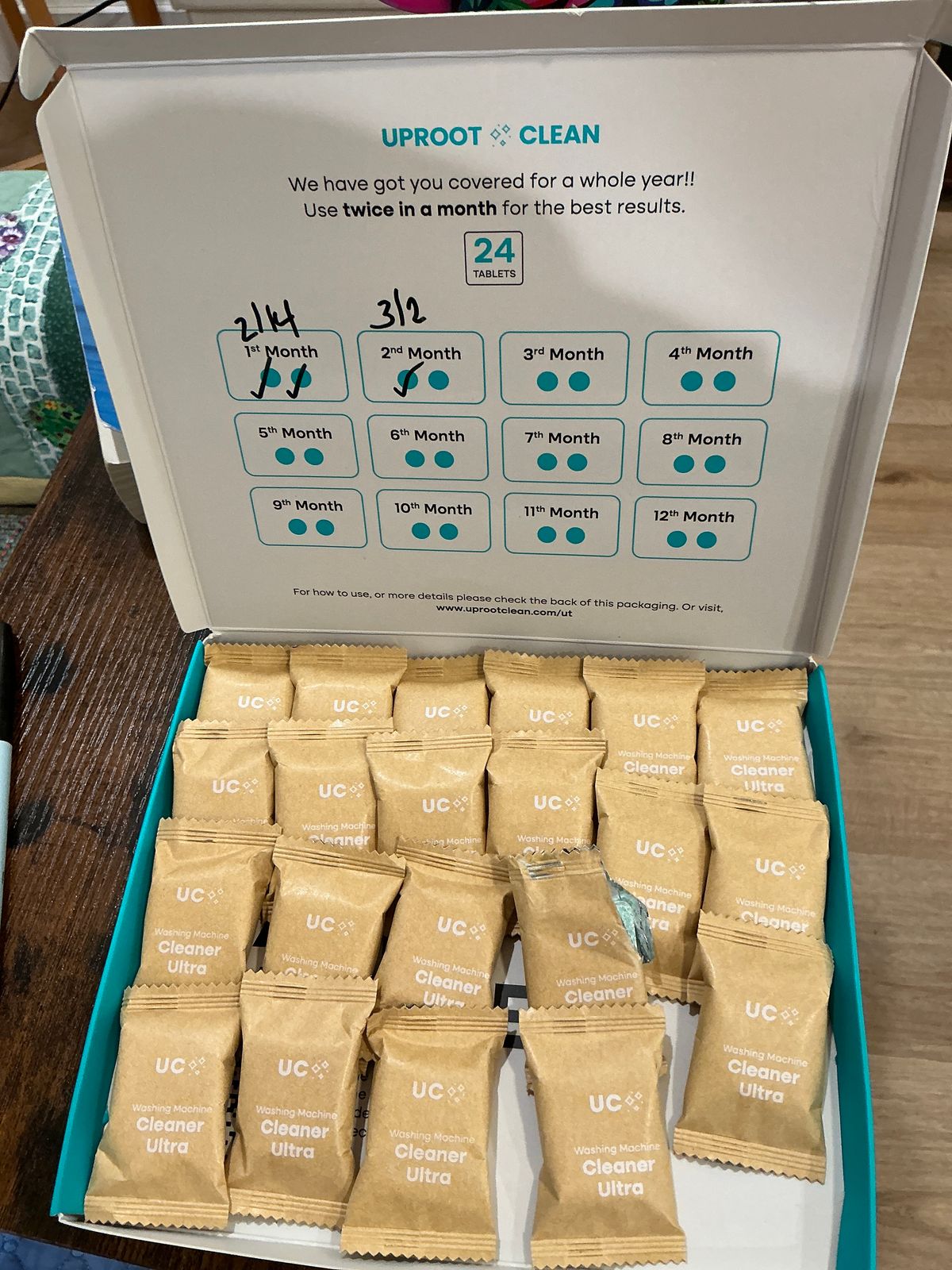 Box of Uproot Clean washing machine cleaner tablets with 24 individual packets and usage chart showing twice monthly application for 12 months