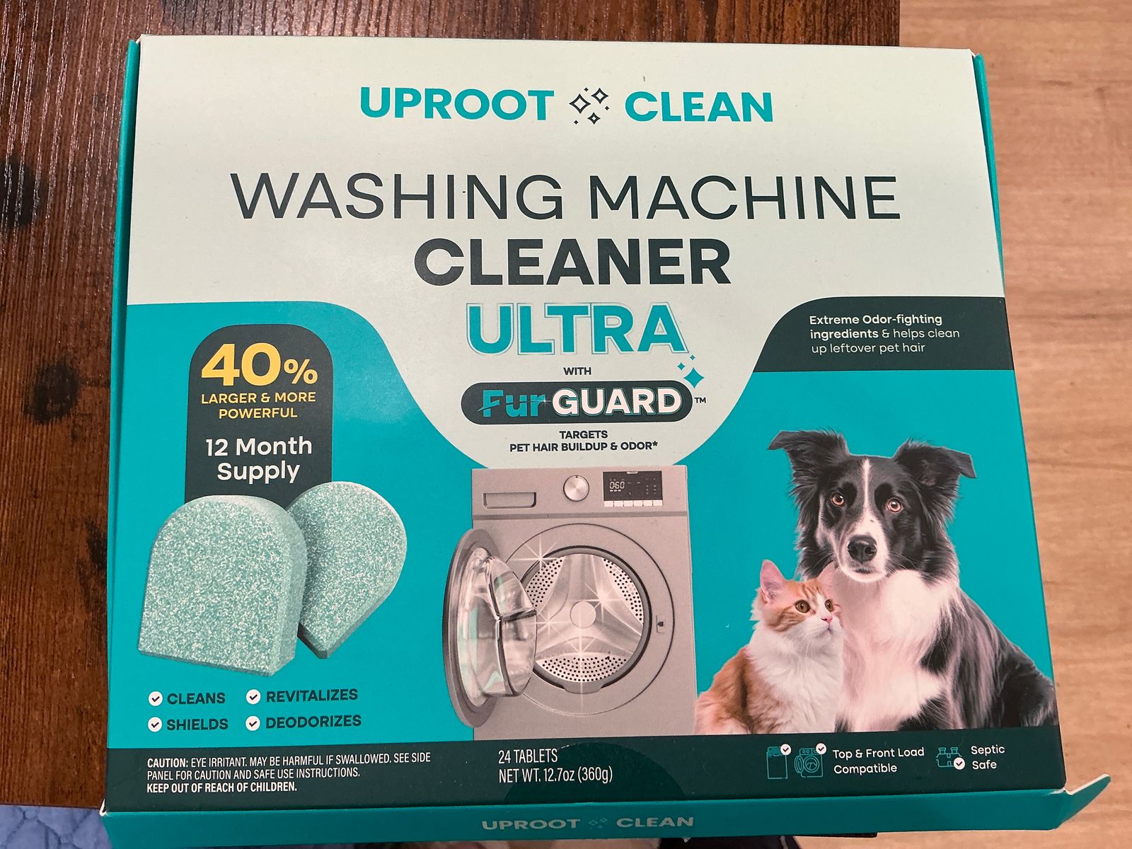 Package of Uproot Clean washing machine cleaner tablets designed for pet owners, featuring images of cleaning tablets, a washing machine, and a dog and cat