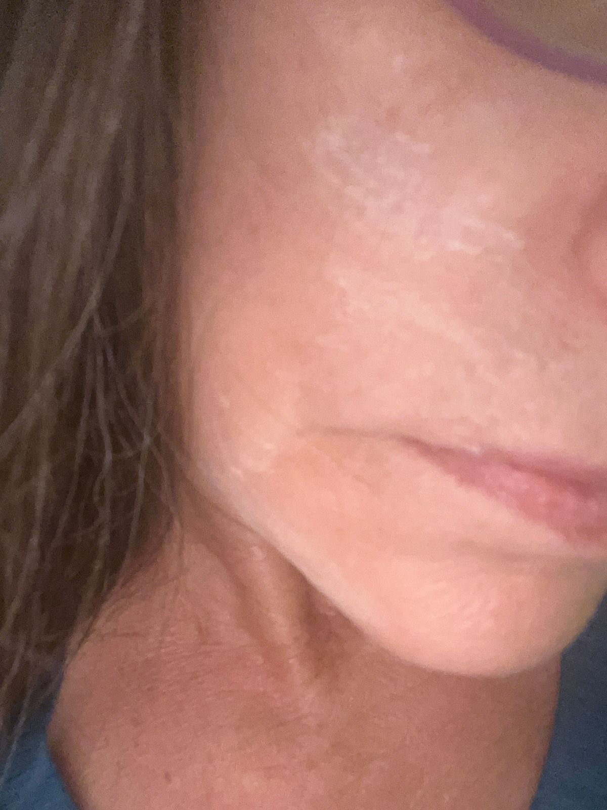 Close-up portrait showing part of a person's face in profile